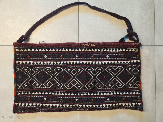 A rare and charming baby carrier from the Shavak tribe of southeastern Anatolia. Very rare, as it was only made for personal use. The last photo shows a photo by Josephine Powell  ...