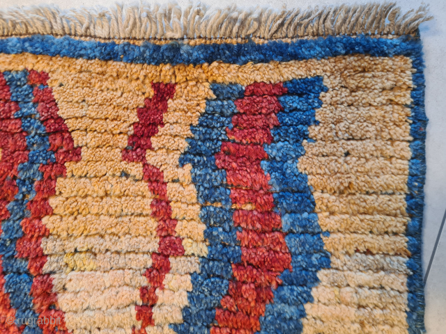 A beautiful, cute, genuine, tribal Qashqai "children" gabbeh rug with stunning natural colors. Presumably intended as a children's sleeping rug. It features a stunning asymmetrical pattern. It is in very good condition.  ...