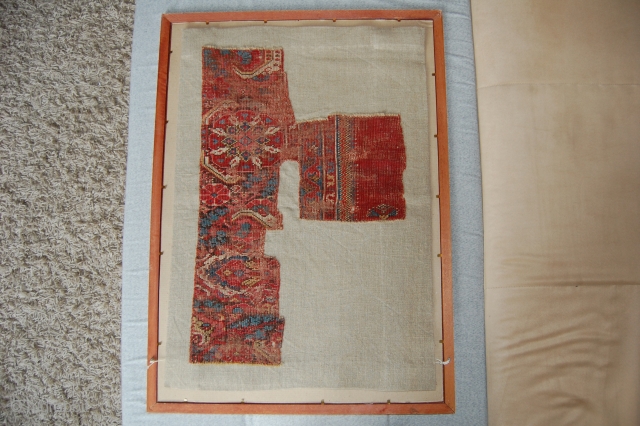 West Anatolian Rug Fragment, circa 17th century. Mounted. Size of linen support (Full size): 46x66cm (Fragment size: about 37x56cm).              