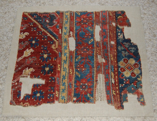 West Anatolian Ushak Rug Fragment. Mounted. Size of linen support (full size): 76x90cm, fragment size: about 66x80cm.                