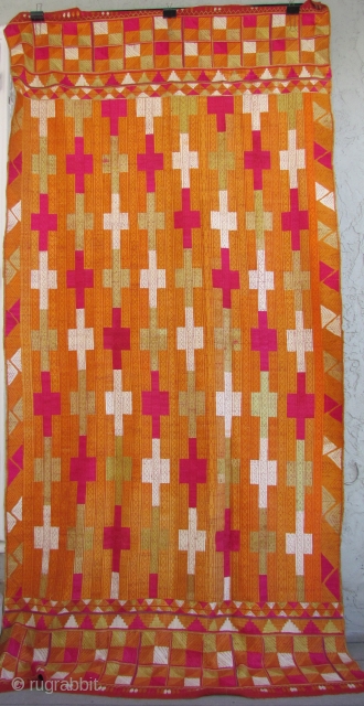 This Punjab Bagh phulkari measures 50 inches x 106 inches. There are 2 small areas where the magenta dye has bled onto a neighboring area where the cloth was folded. The overall  ...