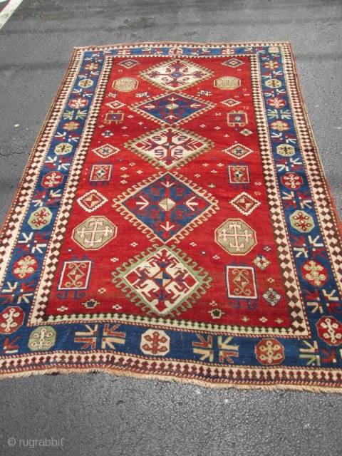 Antique Caucasian Kazak.

size 5'x7'10'' . condition very good for the age ,low pile very smalls re pile. wool on wool foundation. ends and sides intact..circa 1900.good colors.      