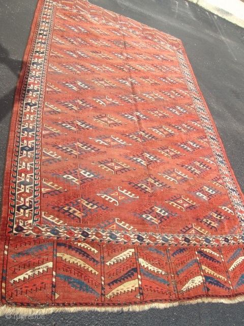 19TH century Yomud Turkoman Rug.

size 5'3''x9'3''. condition low even pile ,some old re pile. ends and sides intact. no stain and wholes.wool on wool foundation. good old  rug.    