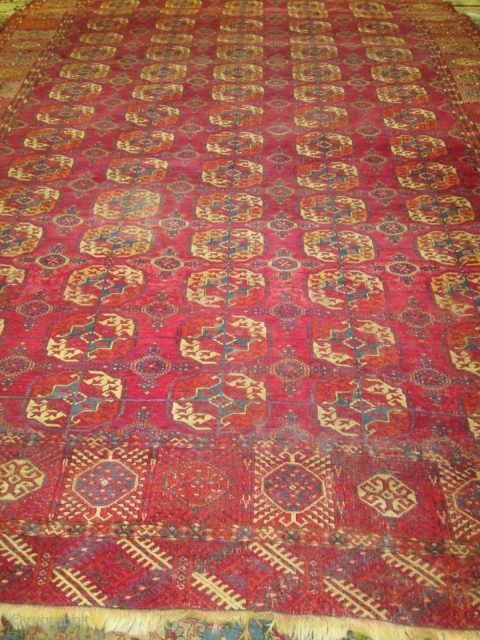 Antique Tekke Turkoman Rug.

size 11'4'' x 7'9''. condition very good for the age ,low even pile with one small spot lower then other part of the rug.  needs a bath.fine quality  ...