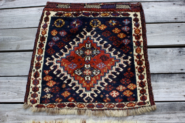 Late 19th century Persian Khemseh Federation single bag face without backing.  Size: 2'2" x 2'.  Fastening loop slots intact  in heavily brocaded chevroned skirt on top end.  Handwashed.  ...
