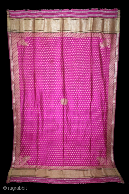 Odhni Zari Brocade(Real Silver and Gold) from Jamnagar Gujarat India.The pattern is made up of kairi,paisley, placed as a konia at the corners of the pallu.The broad plain chaudani pallu is outlined  ...