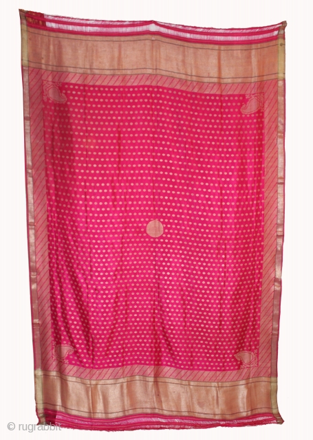 Odhni or veil woven on a 60" wide loom in the 19th century .The pattern is made up of kairi,paisley, placed as a konia at the corners of the pallu.The broad plain  ...