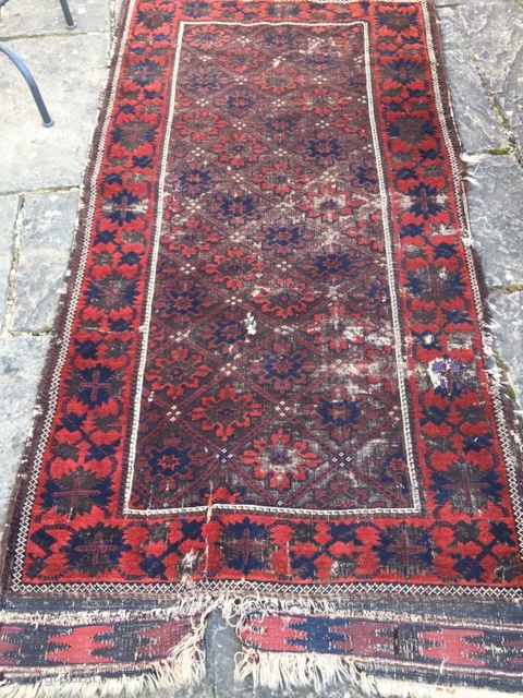 19th century Belouch rug, in distressed condition.
Stunning wool quality and good saturated colours, with non-typical design.
210cm by 104cm (7ft by 3ft 6in)           