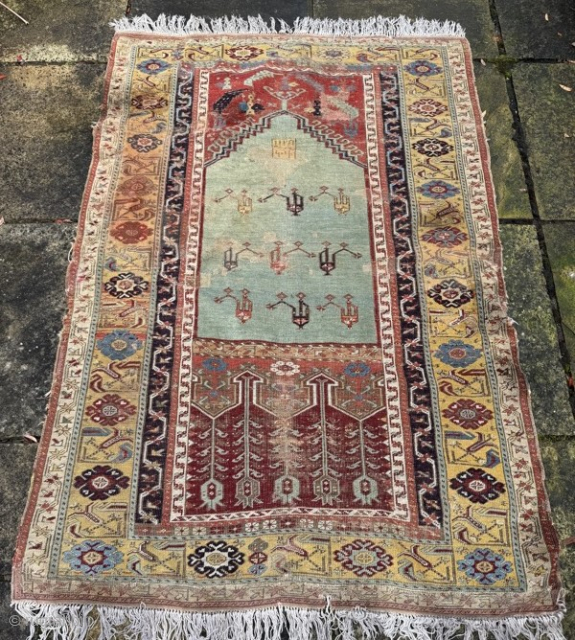 Early 19th century Ladik, in need some t.l.c. Patched, tatty, old repairs, stained, but still very charming... 1.75m by 1.20m
Contact gene@heritage-antique-rugs.com for more pics, price etc.