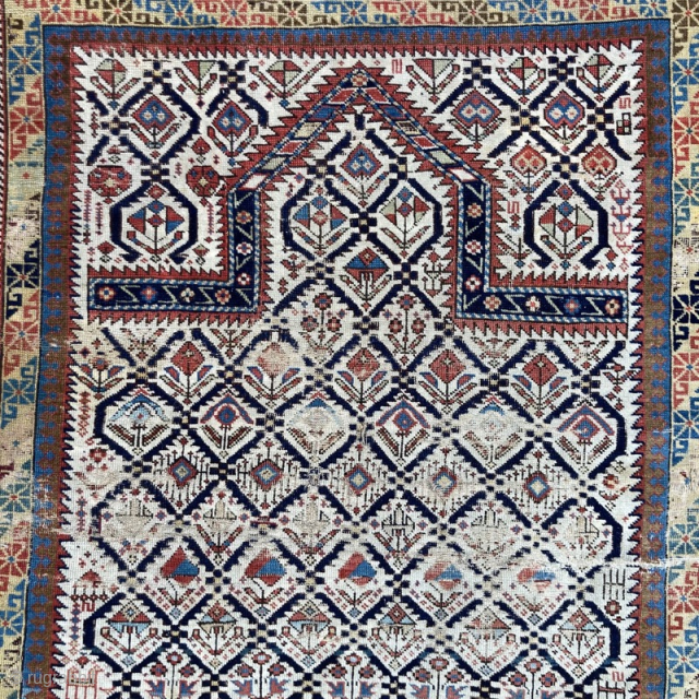 Caucasian prayer rug, 1870's. Strong colours, varied design elements, but showing signs of heavy wear
1.34m by 1.12m
Contact gene@heritage-antique-rugs.com for more pics, price etc.
          