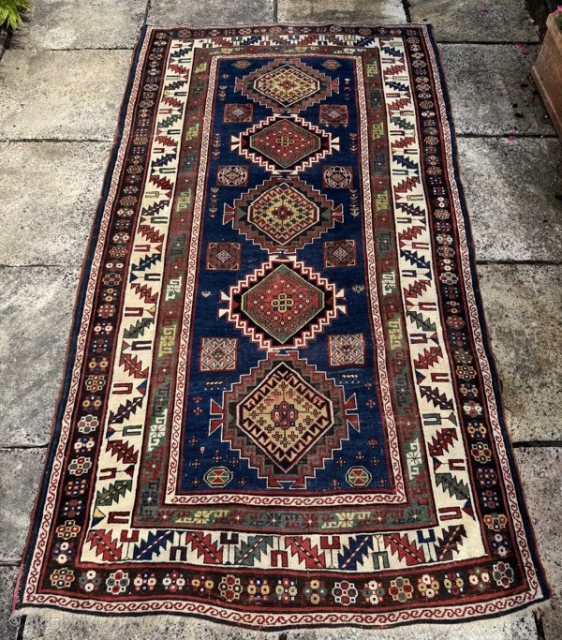 Classic kazak longrug, good colours, strong graphics, some areas of wear and corrosion to the black pile.
2.47m by 1.36m
Contact gene@heritage-antique-rugs.com for more pics, price etc
WhatsApp +44 (0)7803341863