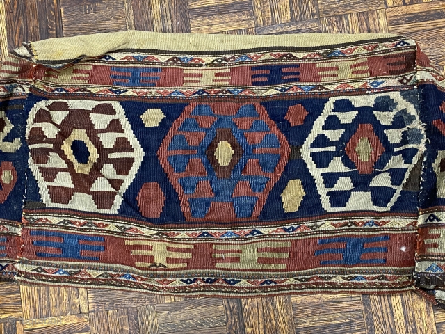 Shahseven kilim cargo bag, 2’10” x 1’10” x 1’9”/ 86 x 56 x 53 cm.

Decorated on four sides with hexagons inhabited by hooked diamonds. On the bottom with red

and yellow stripes.  