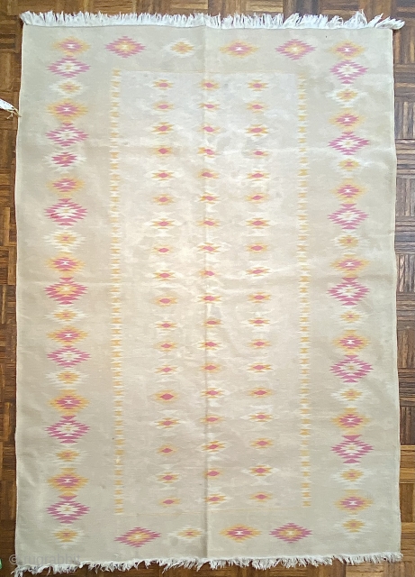 5’0 x 12’0 Dhurrie, ca. 1920, with serrated diamonds in pale orange,
white, and pink                   