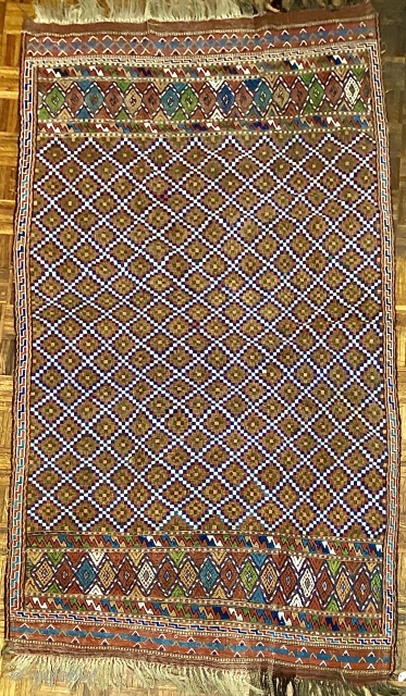 Quchan Kurd Soumac small carpet, ca.1890;
5’4” x 8’11” / 163 x 272 cm.  Field populated by a 
diaper pattern of concentric stepped diamonds, 
with an “elem” panel of diamonds set between  ...