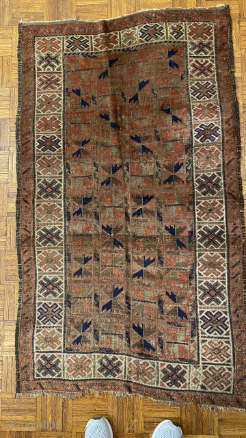 Afghan Balauch rug, ca. 1880;  3’4” x 6’6” / 102 x 198 cm.;

Field of “boxed cabbage” leaves and a running dog border variant as 

trunks and branches. Main border cross-hatch totems  ...