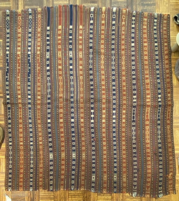 Jajim, ca. 1890; 5’9” x 6’0” / 175 x 183 cm.

Field adorned with multicolored bands and totemic symbols, wear at the sides, a few discreet 

holes, and one re-sewn cut.   