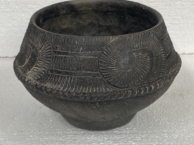 Bang Chaing Vessel / Bowl, black, Bronze Age, ca. 1st - 2nd Millenium BCE; 5”/ 12.7 cm height; 

Purchased from a Legitimate Educational Institution Auction sale

Upper hemisphere decorated with large curls containing  ...