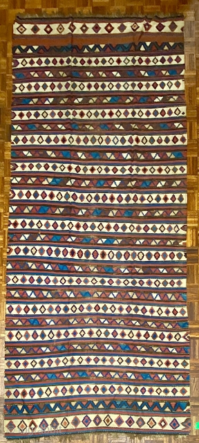 Exceptional Mid 19th C. Shir-van Kilim, ca. 1860; 5’1” x 11’11” / 155 x 363 cm.

Saturated natural colors, and fluid drawing.  Archaic features: extra band width at the ends,

and rainbow inclusions  ...