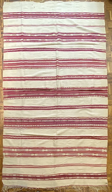 Moroccan Kilim Rug, 19th C; 4’9” x 8’7” / 145 x 262 cm

Wine-red and pale ivory stripes with totemic designs,

a few of them in steel blue. Rhythmically dynamic.


Light wear, soft stains, a  ...