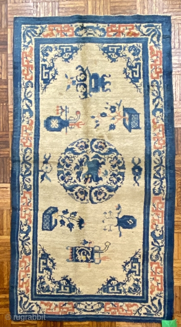 Ningshia Chinese Rug, 19th C; 3’11” x 5’ 10” / 119 x 178 cm

Foo-Dog medallion at center of field with arrangements of

meritorious “scholars’ objects”. Fret-work dragons in the 

main border woven in  ...