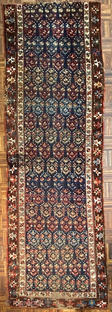 Antique Kurdish Runner Fragment, ca 1850; 3’5” x 9’5” / 104 x 287 cm

113-inch long fragment of an indigo ground Kurdish runner with a beautifully drawn rendering of

oft seen floral ovoid with  ...