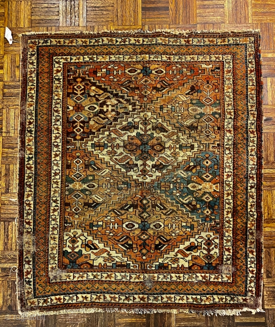 Afshiar Rug ca. 1900 or earlier; 4’4” x 4’11” / 132 x 150 cm

Field composed of stepped diamonds in a lattice. Each diamond with a lobed blossom at center, part of 

a  ...