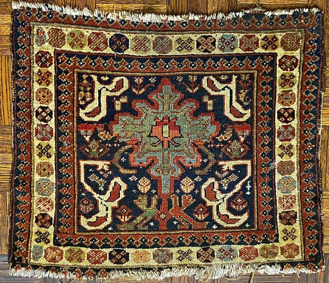 Antique Luri Bagface, ca. 1875, 2’0” x 2’9” // 61 x 74 cm

A central medallion, cloudband or snowflake shaped, in sky-blue

and mint-green on a deep indigo ground. Medallion linked to a pair  ...