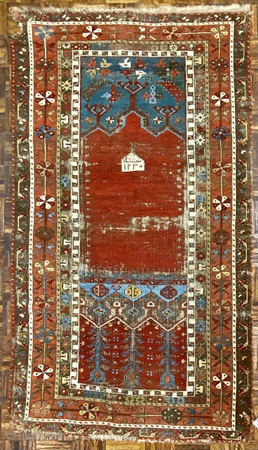 Antique Ladik Prayer rug, dated A.H. 1230 ( 1815 CE); 3’7” x 6’5”

Woven a relatively long vertical shape, this Ladik features the classic

arrangement of a red, triple-arch mihrab set above a panel  ...