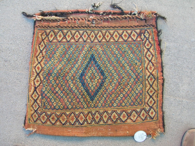 N.W. Persian 1/2 saddlebag .... circa 1875....24"x 24"...a bulky extra-weft wrapping...all vegetal dyes....wool on cotton w/ goat-hair bindings...condition as shown             