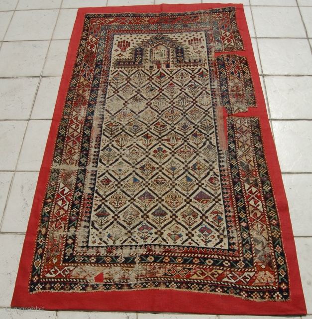 Caucasian Shirvan Prayer Rug. 
Mounted/size of the linen support(Full size): 110 x 182cm (size of the rug fragment: 100 x 172cm). 19th century, I was told over 150 years old. Provenance: The  ...