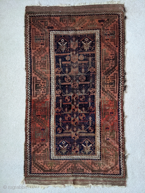 Stunning antique Baluch. 5ft 6in x 3ft 1in. Real unique center panel design. High soft wool except the corroded brown areas. Great colors.

Cheers.          