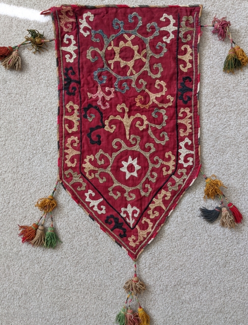 Antique Uzbek Lakai silk embroidered trapping that was used on the end of tent poles. Beautiful piece with original silk tassles.

1'1" x 2'4" (to bottom of the lower tassle)

Cheers.    