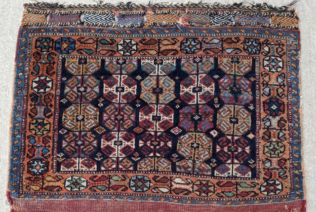 Late 19th century Afshar bag. Unique design with some Kurdish influence. 2'2" x 2'9". Wonderful dyes and soft shiny wool. Great pile condition. Let me know if you need more info.

Cheers.  