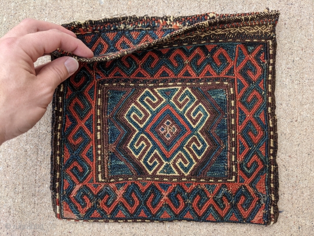 Gorgeous sumak Antique Baluch bag/ chanteh. 11" x 11.5" or 28 x 29cm. This is one of more attractive pieces I've owned. I've also heard similar pieces labeled as Chahar Aimaq.

Cheers.  