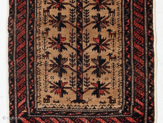 Antique Baluch balisht (pillow face) with camel hair field. 1'6" x 2'8" or 46 x 82cm. Love the goats woven on either side of the tree of life.

Cheers.
     