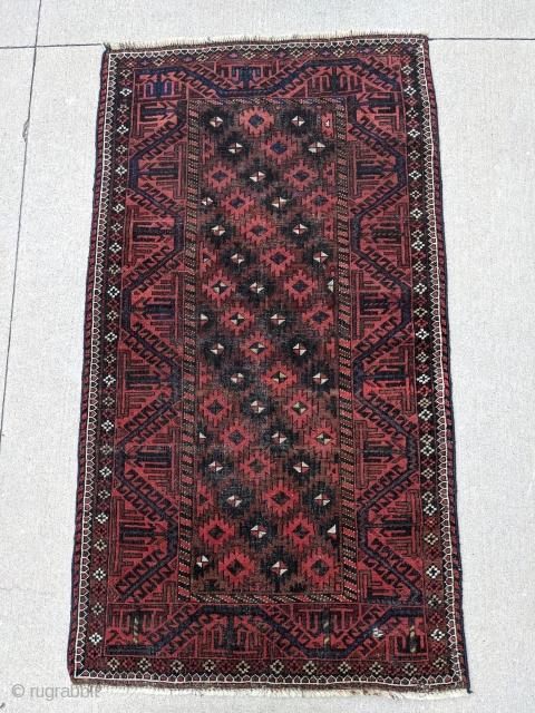 Old Baluch rug. 3'2" x 5'8". Nice range of colors. Ends and sides secured. One finertip sized hole that's been secured.            