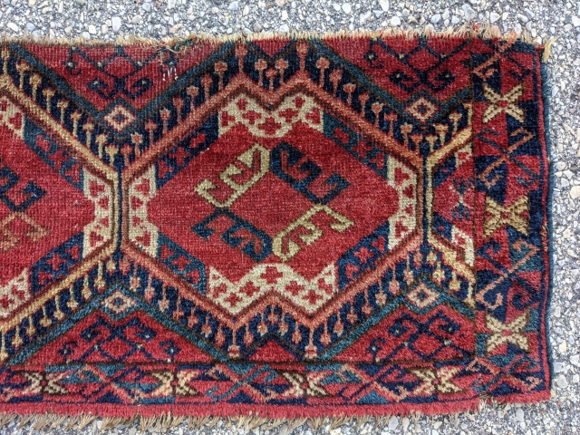 Antique Middle Amu Darya Torba. 1'1" x 3'2". Gorgeous colors with the dyrnak gul in the middle of the main guls. Missing the top border.

Cheers.        