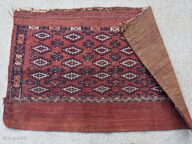 Antique Yomut flatwoven bag with original back. 2'5" x 3'10". Tight weave.                     