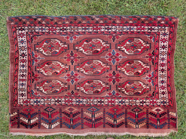 Antique Yomut chuval with complete elem. It does have a bright red. I washed it with very little color transfer but there were still some in a few spots (from a previous ...