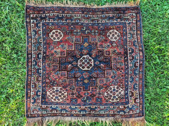 Nice Shiraz mat. Fluffy wool and great colors. 2'9" x 2'9" or 84 x 84cm. Available. (Also there's no staining on this on the right side, that was the sun rays peaking ...