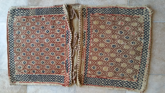 Qashqai Khurjin (saddlebag )
Textile size :95 x 52 cm
Wool on wool 
Natural color ( yes )
front :
Flatweave (twisted technique )( Shiraki )
back :
Flatweave ( twisted  technique )( Shiraki )
Age 95 years  ...