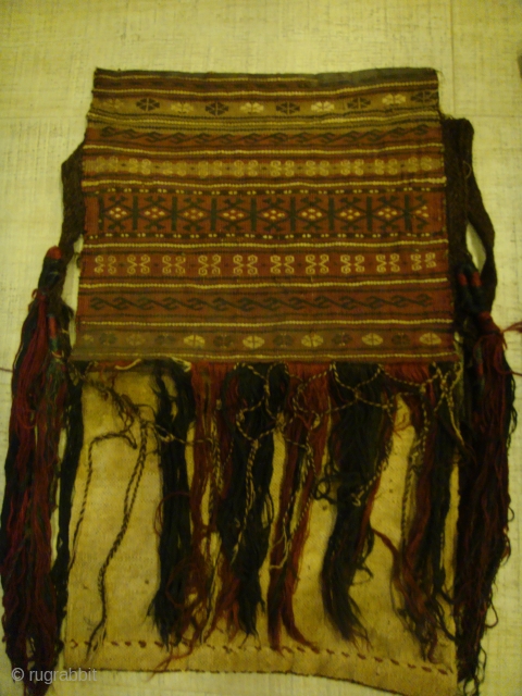 2 pieces, Late 19th/Early 20th Century Tekke Turkmen Saddle Bags (Wool-on-Cotton). with unstitched backs. Can do with some cleaning.
Dimensions: Bag Fronts --- Lengths: Approx.34cm-38cm. Widths: Approx.38cm-39cm. Bag Fringes: Approx.28cm 
Side-Tassels: Approx.42cm-49cm length  ...