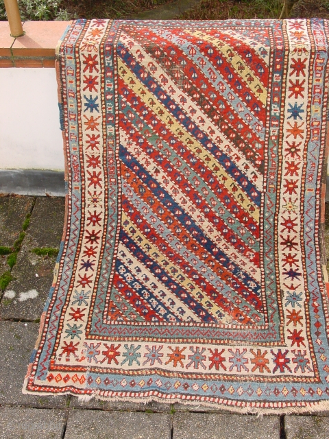 wonderful antique 1870 caucasison, superbe natural colors two reaired places, good pile, some minor coroaion, flat laying


94x173cm
3.1x5.8ft                