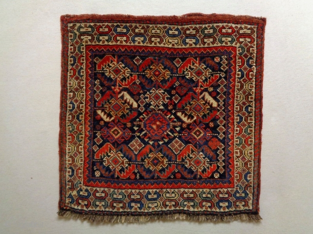 Kurdish Bagface
Size: 65x63cm
Natural colors (except the red color is probably not natural), made in circa 1910/20                 