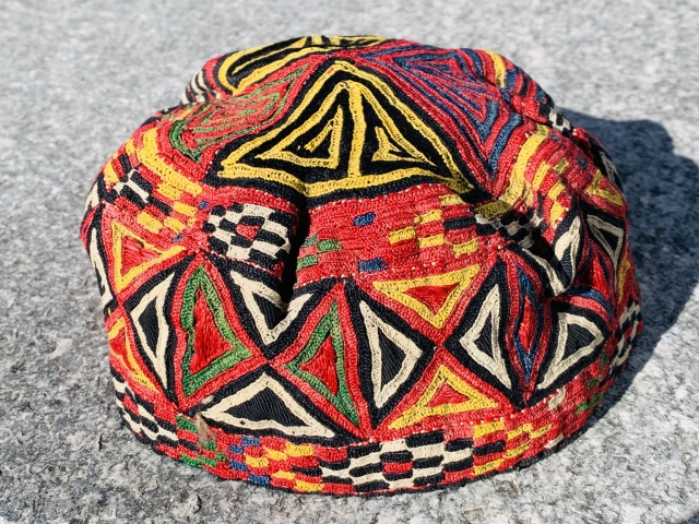 	A fully embroidered hat from Central Asia. They are composed of silk embroidery on cotton and linen..                