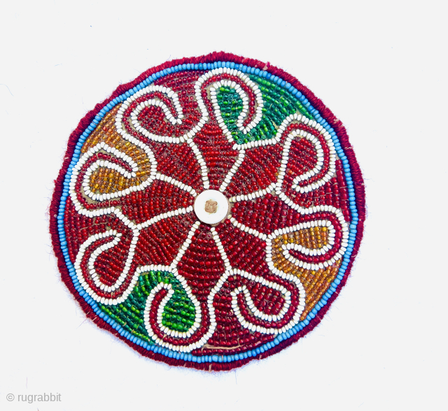 Antique north Afghanistan glass beaded  beads on cotton with Shell button In the center. Diameter 14cm Please Contact this email for more information.
hamidparsacarpet@yahoo.com         