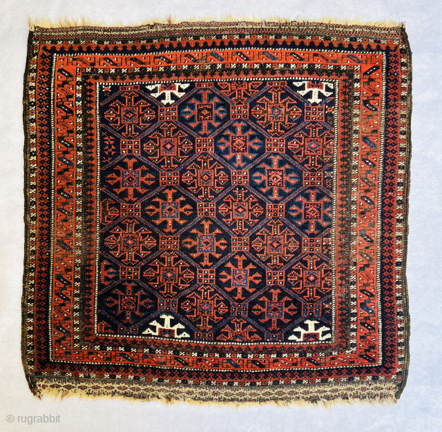 Baluch Masnad (sitting rug) circa 1880, featuring gorgeous shades of blue, white, red, and natural brown wool, oxidized in some areas. Beautiful flatwoven ends (weft floating technique), all wool. One very small  ...
