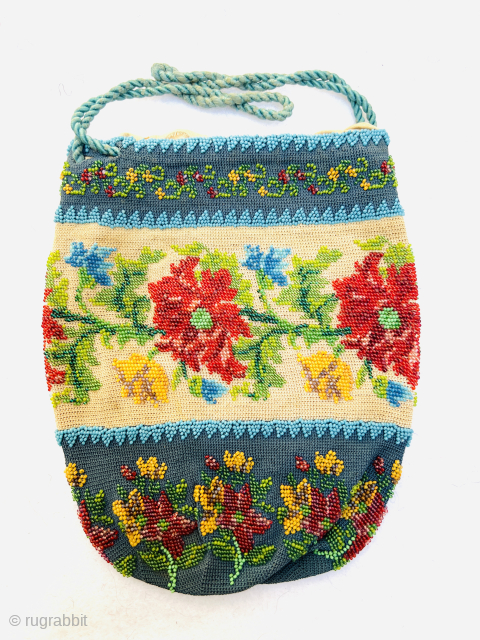 French beaded réticule purse,
a 19th-century artifact —
a handcrafted piece from a time when elegance was the language of life.
The glass beads along its border, like silent stars,
hold the memories of French aristocratic  ...