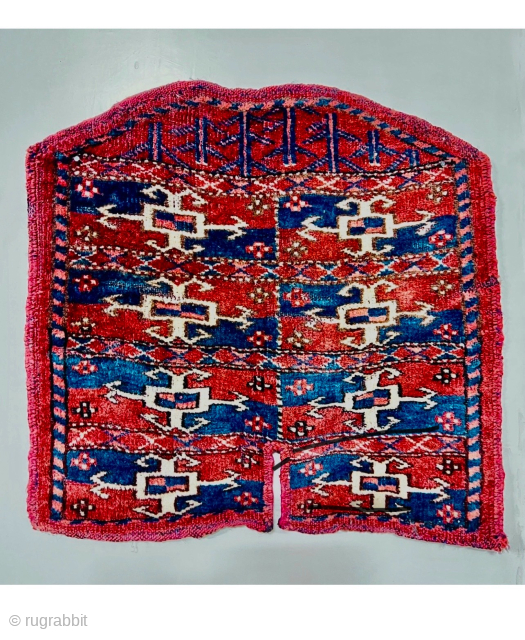 Second of the 19th.c Yumod Turkmen Saddle Cover,Nice strong natural colors and wonderful mid-blue Asymmetric textured open on left,42x43cm perfect condition
Please Contact this email for more information. 
hamidparsacarpet@yahoo.com     