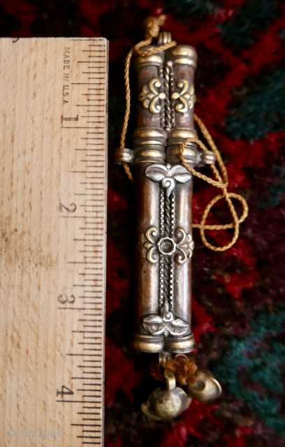 Antique Tibetan needle case;   brass and copper with 'wisdom eyes' in silver;  19th c.  5".  Amazing piece and rare.

SOLD         